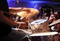 a man is playing drums at a party