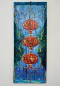 a painting of red lanterns hanging on a wall